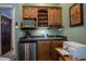 Convenient wet bar in the home office with microwave, mini-fridge, and coffee maker at 300 Madrid Blvd, Punta Gorda, FL 33950