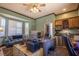 Spacious home office with built-in cabinets, desk, and plenty of natural light at 300 Madrid Blvd, Punta Gorda, FL 33950