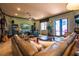 Open concept living room with sectional sofa and built-in shelving at 300 Madrid Blvd, Punta Gorda, FL 33950