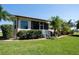 Single-Gathering home with screened-in patio and landscaping at 300 Madrid Blvd, Punta Gorda, FL 33950