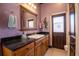Elegant bathroom with dark wood vanity, granite countertop, and walk-in shower at 300 Madrid Blvd, Punta Gorda, FL 33950