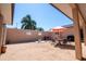 Private courtyard with table, chairs, and umbrella at 300 Madrid Blvd, Punta Gorda, FL 33950