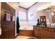 Bathroom with corner soaking tub, double sinks, and modern design at 300 Madrid Blvd, Punta Gorda, FL 33950