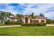 Single-Gathering house with three-car garage, palm trees at 300 Madrid Blvd, Punta Gorda, FL 33950