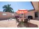 Private courtyard with table, chairs, and umbrella at 300 Madrid Blvd, Punta Gorda, FL 33950