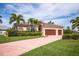 Single-Gathering home with three-car garage and lush landscaping at 300 Madrid Blvd, Punta Gorda, FL 33950