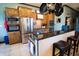 Modern kitchen featuring a large island with seating and granite countertops at 300 Madrid Blvd, Punta Gorda, FL 33950