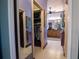 Walk-in closet and bathroom with double sinks and tile floor at 300 Madrid Blvd, Punta Gorda, FL 33950