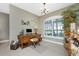 Home office with built-in desk and large window at 24080 Buckingham Way, Punta Gorda, FL 33980
