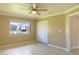Bedroom with large window, ceiling fan and double door closet at 21150 Gertrude Ave # A3, Port Charlotte, FL 33952