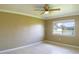 Spacious bedroom with tile flooring and ceiling fan at 21150 Gertrude Ave # A3, Port Charlotte, FL 33952