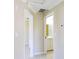 Hallway with doors to bathroom and bedroom at 21150 Gertrude Ave # A3, Port Charlotte, FL 33952