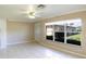 Bright living room with tile flooring and large windows at 21150 Gertrude Ave # A3, Port Charlotte, FL 33952