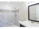 Updated bathroom with marble shower and vanity at 21150 Gertrude Ave # A3, Port Charlotte, FL 33952