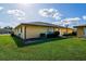 Condo exterior with a well-maintained lawn at 21150 Gertrude Ave # A3, Port Charlotte, FL 33952
