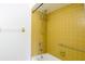 Yellow tile shower and tub with grab bar at 21150 Gertrude Ave # A3, Port Charlotte, FL 33952