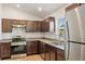 Kitchen with stainless steel appliances and granite countertops at 11912 Brookside Ave, Port Charlotte, FL 33981