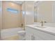 Stylish bathroom featuring modern fixtures, a combination tub and shower, and a sleek vanity at 1293 Preston St, Port Charlotte, FL 33952
