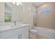 Bright bathroom featuring modern fixtures, a combination tub and shower, and a sleek vanity at 1293 Preston St, Port Charlotte, FL 33952