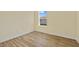 Bright bedroom featuring durable wood-look floors and a well-lit ambiance from a sunlit window at 1293 Preston St, Port Charlotte, FL 33952