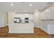Modern kitchen featuring white cabinets, stainless steel appliances, and a center island at 1293 Preston St, Port Charlotte, FL 33952