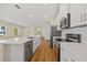 Bright kitchen with white cabinets, stainless steel appliances, and a large center island at 1293 Preston St, Port Charlotte, FL 33952