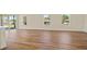 Large living room with views of the outside, featuring wood-look floors and neutral walls at 1293 Preston St, Port Charlotte, FL 33952