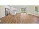 Open-concept living area featuring modern wood flooring, recessed lighting, and sliding doors to the outdoors at 1293 Preston St, Port Charlotte, FL 33952