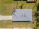 Aerial view of roof and backyard featuring green grass and blue sky at 1301 Preston St, Port Charlotte, FL 33952