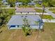 Aerial view of roof and backyard showing nearby houses and a street at 1301 Preston St, Port Charlotte, FL 33952