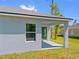Backyard view of a single-Gathering home, featuring a covered patio area at 1301 Preston St, Port Charlotte, FL 33952