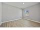 Neutral bedroom with wood-look floors and one window at 1301 Preston St, Port Charlotte, FL 33952