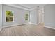Spacious bedroom with tray ceiling, wood-look floors and abundant natural light at 1301 Preston St, Port Charlotte, FL 33952