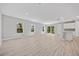 Spacious living room with plank floors and sliding glass doors for natural light at 1301 Preston St, Port Charlotte, FL 33952