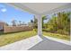 Covered outdoor patio area with a view of the backyard, perfect for relaxing and entertaining at 1301 Preston St, Port Charlotte, FL 33952