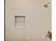 Tiled shower featuring a niche and modern shower head at 1301 Preston St, Port Charlotte, FL 33952