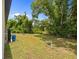 A generous sized backyard has the perfect amount of privacy and mature landscaping at 1415 Nackman Rd, North Port, FL 34288