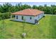 A lush green backyard awaits with the perfect amount of privacy and tranquility at 1415 Nackman Rd, North Port, FL 34288