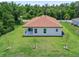 A perfectly sized backyard featuring lush green grass and plenty of room for entertaining at 1415 Nackman Rd, North Port, FL 34288