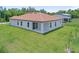 A large backyard and covered patio make this home perfect for entertaining guests at 1415 Nackman Rd, North Port, FL 34288