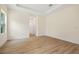 Bright, spacious bedroom featuring wood-look flooring, neutral walls, and ample natural light through a window at 1415 Nackman Rd, North Port, FL 34288