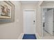 Bright condo entryway with white door and blue rug at 14271 Heritage Landing Blvd # 1526, Punta Gorda, FL 33955