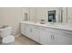 Double vanity bathroom with modern white cabinets at 14271 Heritage Landing Blvd # 1526, Punta Gorda, FL 33955