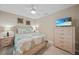 Bedroom with a king-size bed, dresser, and TV at 14271 Heritage Landing Blvd # 1526, Punta Gorda, FL 33955