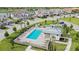 Community pool with lounge chairs and cabana in a residential area at 14271 Heritage Landing Blvd # 1526, Punta Gorda, FL 33955