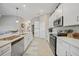 Modern kitchen with white cabinets and island at 14271 Heritage Landing Blvd # 1526, Punta Gorda, FL 33955