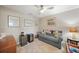 Bright home office features a comfortable sofa and mini-fridge at 14271 Heritage Landing Blvd # 1526, Punta Gorda, FL 33955