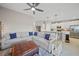 Open living room features a spacious sectional sofa and flows into the kitchen at 14271 Heritage Landing Blvd # 1526, Punta Gorda, FL 33955