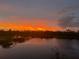 Scenic sunset view over a tranquil lake at 14271 Heritage Landing Blvd # 1526, Punta Gorda, FL 33955