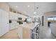 Modern kitchen with white cabinets and large island at 14271 Heritage Landing Blvd # 1526, Punta Gorda, FL 33955